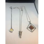 THREE MARKED SILVER NECKLACES TO INCLUDE A FAIRY AND AN AMBER COLOURED ABSTRACT DESIGN