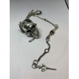 A HEAVY SILVER ALBERT CHAIN WITH LARGE SKULL FOB AND BONE, HAND ETC DESIGN