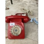 A RETRO RED ROTARY DIAL TELEPHONE