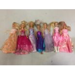 SEVEN DRESSED BARBIE DOLLS