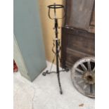 A TALL WROUGHT IRON PLANT STAND