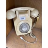 A RETRO CREAM ROTARY DIAL WALL MOUNTED TELEPHONE