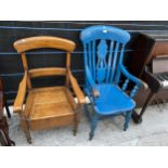 A VICTORIAN PAINTED ELM FARMHOUSE CHAIR AND A COMMODE CHAIR