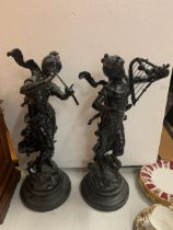 TWO RESIN FIGURINES ON A WOODEN BASES OF LADIES PLAYING MUSICAL INSTRUMENTS 51CM TALL