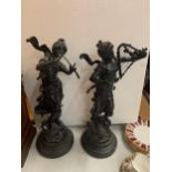 TWO RESIN FIGURINES ON A WOODEN BASES OF LADIES PLAYING MUSICAL INSTRUMENTS 51CM TALL