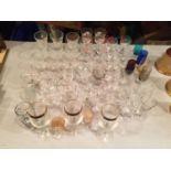 A LARGE AMOUNT OF GLASSES TO INCLUDE WINE, SHERRY, PORT, INCLUDING COLOURED AND FLORAL EXAMPLES