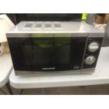 A SILVER MORPHY RICHARDS MICROWAVE OVEN