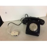 A BLACK VINTAGE DIAL TELEPHONE