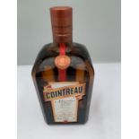 A LITRE BOTTLE OF COINTREAU SPECIALITE DE FRANCE DEPUIS 1849 ANGER 40% VOL