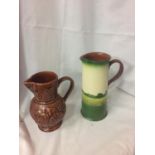 TWO POTTERY JUGS, ONE BEING A DECORATION OF SHAKESPEARE'S HOUSE AND THE OTHER A HALF PINT EMBOSSED