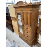 A VICTORIAN ASH MIRROR-DOOR WARDROBE ENCLOSING THREE SHORT AND ONE LONG DRAWER, HANGING SECTION