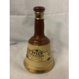 A BELL'S OLD SCOTCH WHISKY 70% PROOF 37.8CL IN A WADE BELL COLLECTABLE BOTTLE