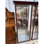 A MODERN TWO DOOR DISPLAY CABINET WITH MIRROR BACK, 30.5" WIDE