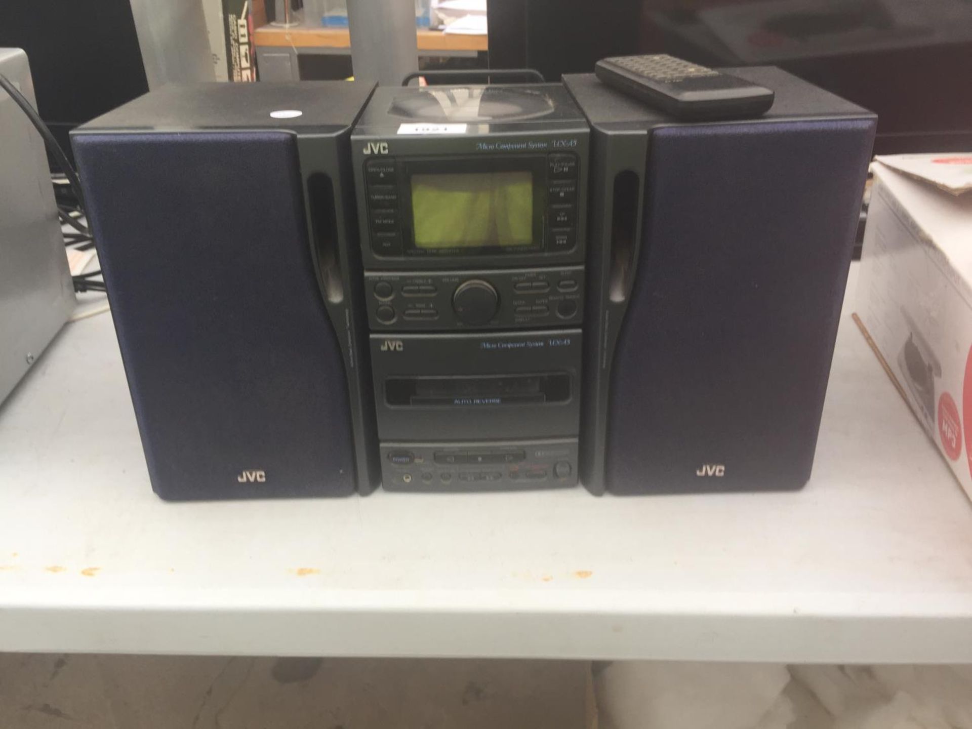 A JVC STEREO SYSTEM WITH TWO SPEAKERS