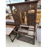 A VICTORIAN HEAVILY CARVED OAK HALL STAND WITH MIRROR-BACK, SIX COAT HOOKS AND SINGLE DRAWER, 47"