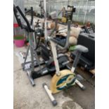 TWO EXERCISE MACHINES - A DELTA BICYCLE AND AN OLYMPUS CROSS TRAINER