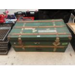 A VINTAGE GREEN PAINTED WOODEN STORAGE CHEST WITH WOODEN BANDING