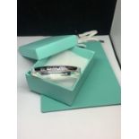 A MARKED 925 FASHION BANGLE GROSS WEIGHT 27.84 GRAMS WITH GIFT BOX AND BAG