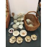 A BASKET OF POTTERY ITEMS TO INCLUDE FOUR MINTONS CUPS AND SAUCERS, COMMEMORATIVE CUPS, MUGS AND