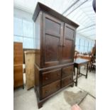 A 19TH CENTURY TWO DOOR PANELLED STAINED PINE CUPBOARD ON BASE ENCLOSING FOUR DRAWERS, ON BRACKET