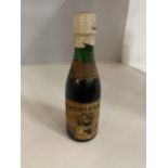 A VINTAGE BOTTLE OF ROBINSONS OLD TOM ALE BELIEVED TO BE IN EXCESS OF 100 YEARS OLD - THE BOTTLE