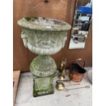 A RECONSTITUTED STONE URN PLANTER ON PEDASTEL BASE WITH LIONS HEAD DECORATION