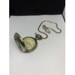 A CHROME POCKET WATCH ON A CHAIN WITH STEAM TRAIN DECORATION IN A PRESENTATION BOX