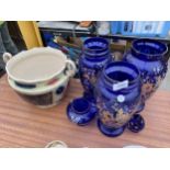 A GROUP OF THREE LARGE BLUE GLASS VASES AND A CERAMIC PLANTER