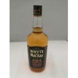 A 1 LITRE BOTTLE OF WHYTE AND MACKAY SCOTCH WHISKY MATURED TWICE EXTRA STRENGTH 52.5% VOLUME