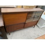 A RETRO TEAK BOOKCASE BUREAU WITH GLASS SLIDING DOORS, 60" WIDE