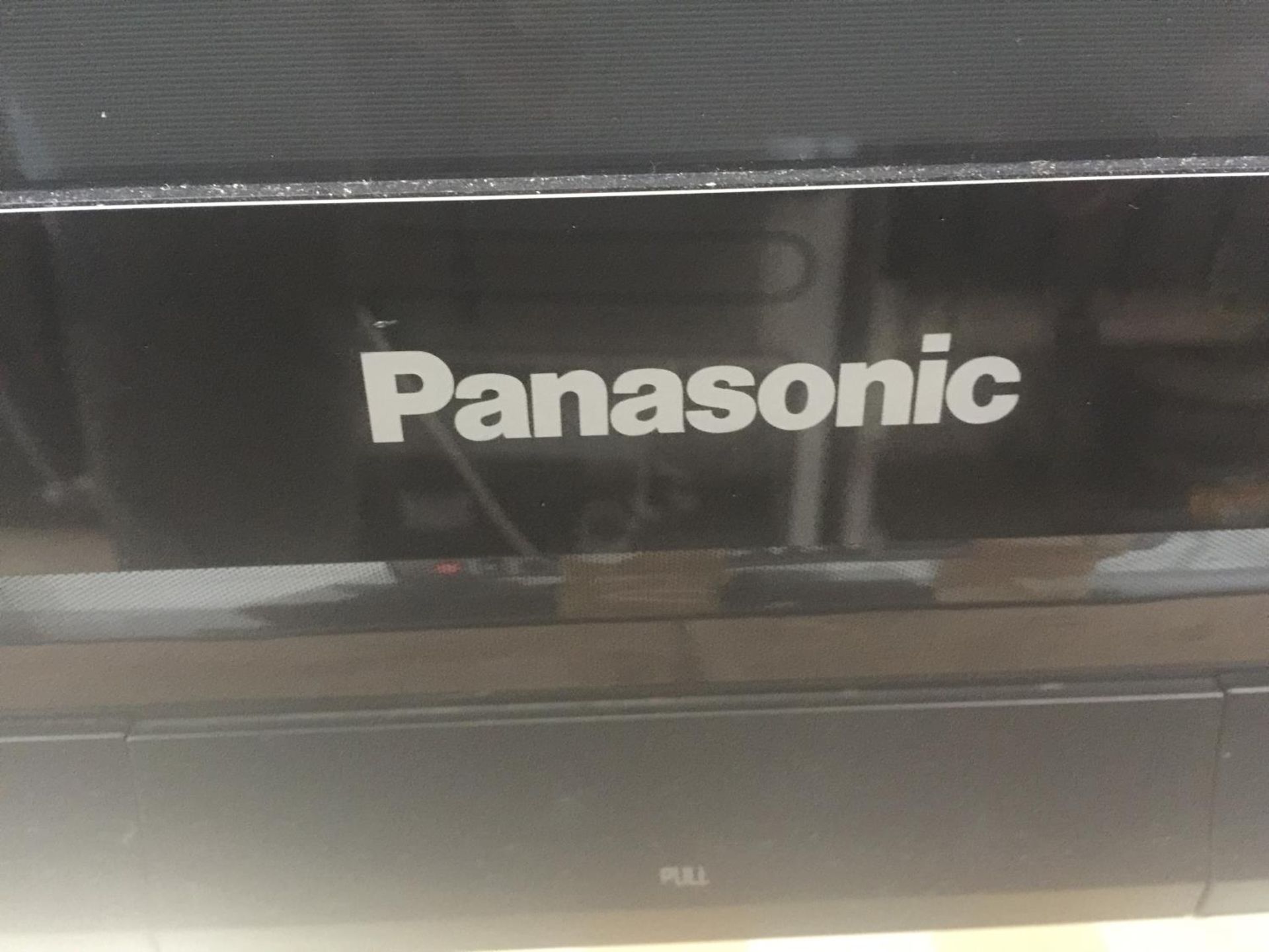 A 42" PANASONIC TELEVISION ON A STAND WITH REMOTE CONTROL - Image 2 of 3