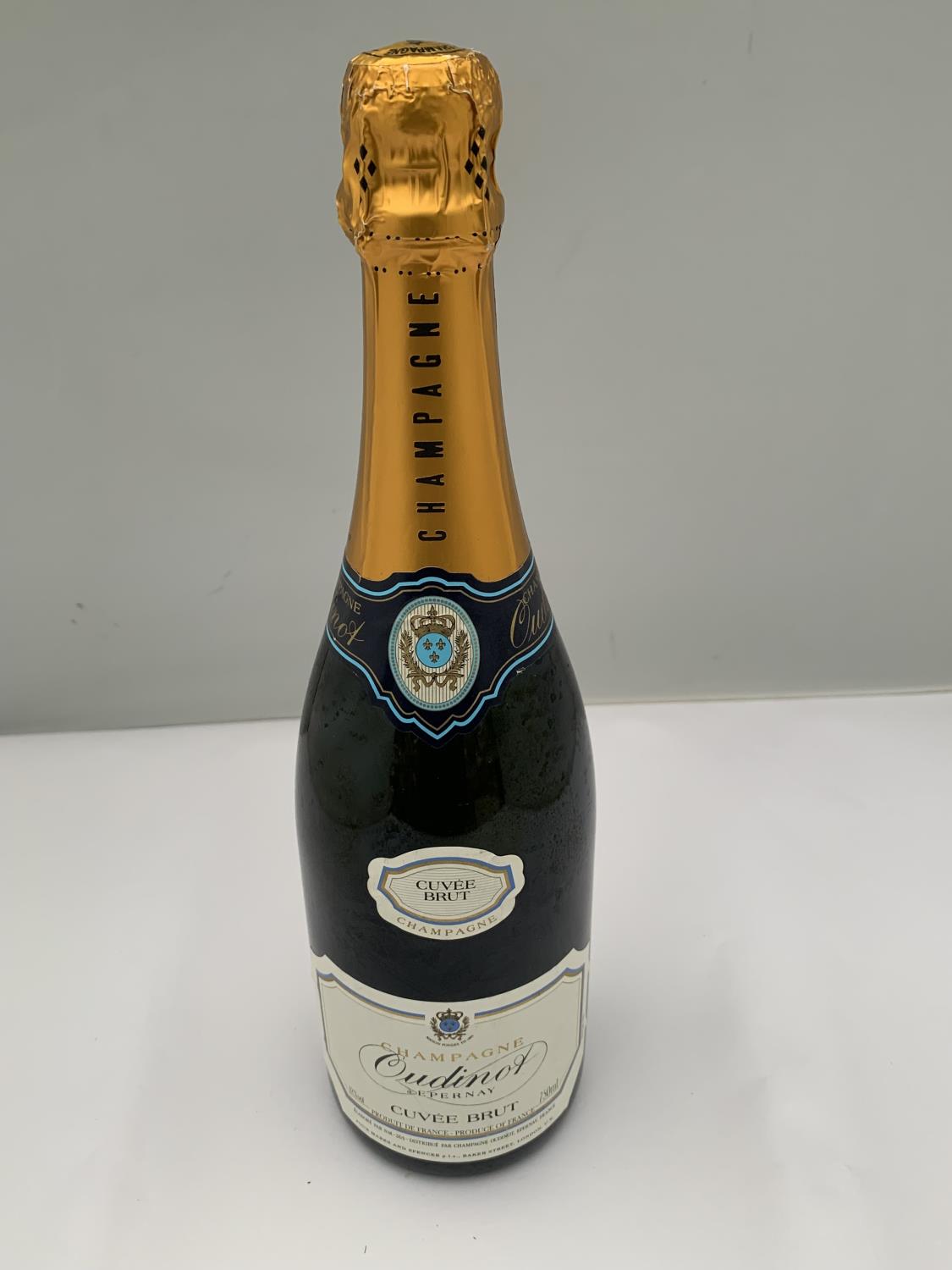 A BOTTLE OF OUDINOT EPERNAY CUVEE BRUT CHAMPAGNE