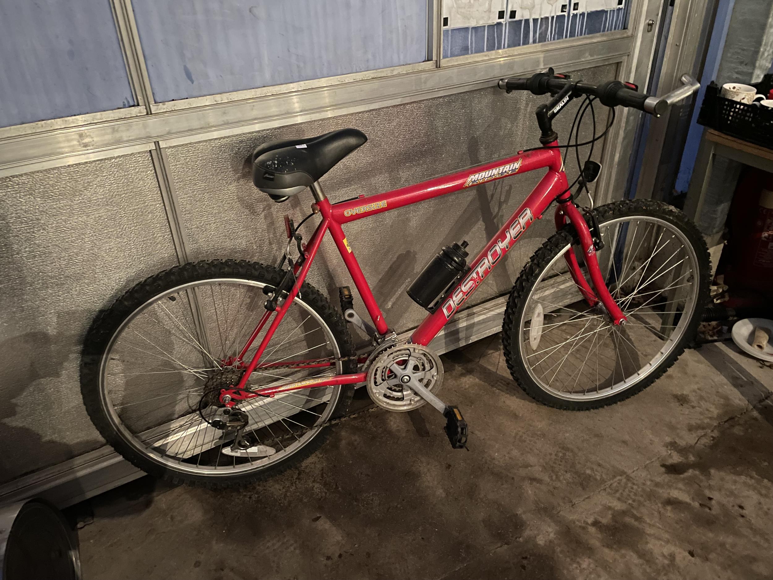 A RED DESTROYER MOUNTAIN BIKE WITH 18 SPEED GEAR SYSTEM