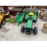 A CHILDRENS SMOBY PEDDLE TRACTOR WITH A TRAILER AND ROLLERS