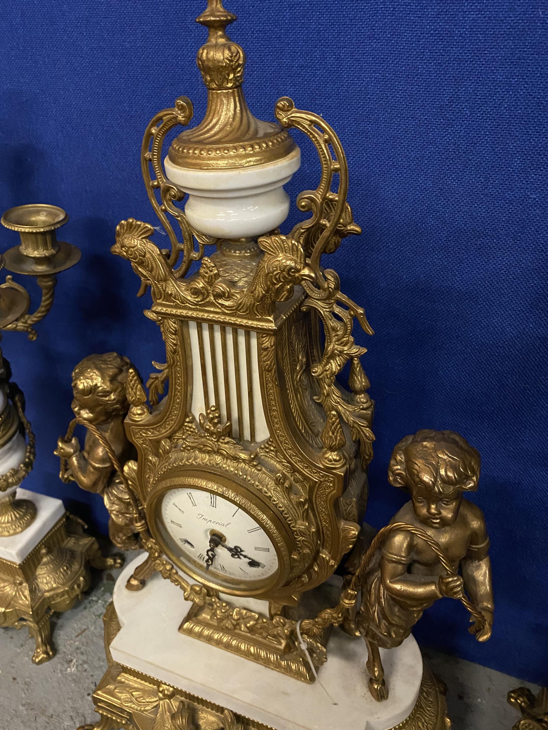 AN ORNATE IMPERIAL FRENCH GILT MANTLE CLOCK ON A MARBLE AND GILT BASE WITH CHERUB FAWN DECORATION - Image 9 of 10