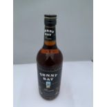 A 1 LITRE BOTTLE OF SUNNY BAY SPECIALLY BLENDED AND FINEST QUALITY DARK RUM