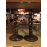 A PAIR OF MAHOGANY BARLEY TWIST CANDLESTICKS