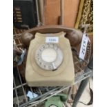 A RETRO BROWN ROTARY DIAL TELEPHONE