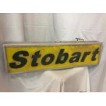 AN ILLUMINATED STOBART SIGN