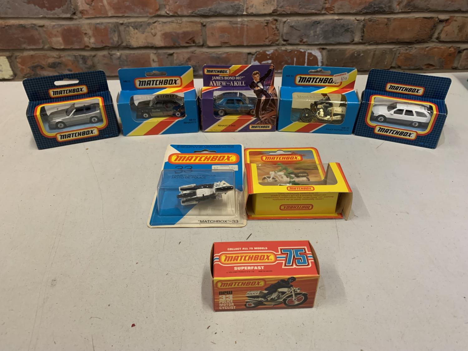 A COLLECTION OF BOXED AND UNBOXED MATCHBOX VEHICLES - ALL MODEL NUMBER 33 OF VARIOUS ERAS AND