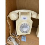 A RETRO CREAM ROTARY DIAL WALL MOUNTED TELEPHONE