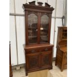 A LATE VICTORIAN MAHOGANY TWO DOOR BOOKCASE ON BASE 42" WIDE