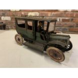 A VINTAGE CARETTE CLOCKWORK CAR CIRCA 1910