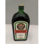 A 1 LITRE BOTTLE OF JAGERMEISTER 35% VOL