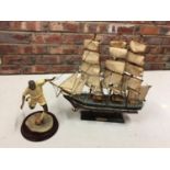 A HAND BUILT MODEL OF THE CUTTY SARK SAILING SHIP AND A FOOTBALLER FIGURINE