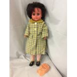 A 1960's VINTAGE DTD DOLL DRESSED IN THREE LAYERS OF CLOTHING AND INCLUDING THE VOICE BOX