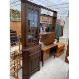 A GLAZED AND LEADED CORNER CABINET