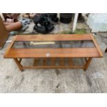 A RETRO MYER TEAK COFFEE TABLE WITH SLATTED MAGAZINE SHELF - GLASS BROKEN