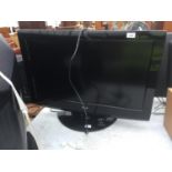 A 32" LG TELEVISION WITH REMOTE CONTROL