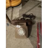 A RETRO BROWN ROTARY DIAL TELEPHONE